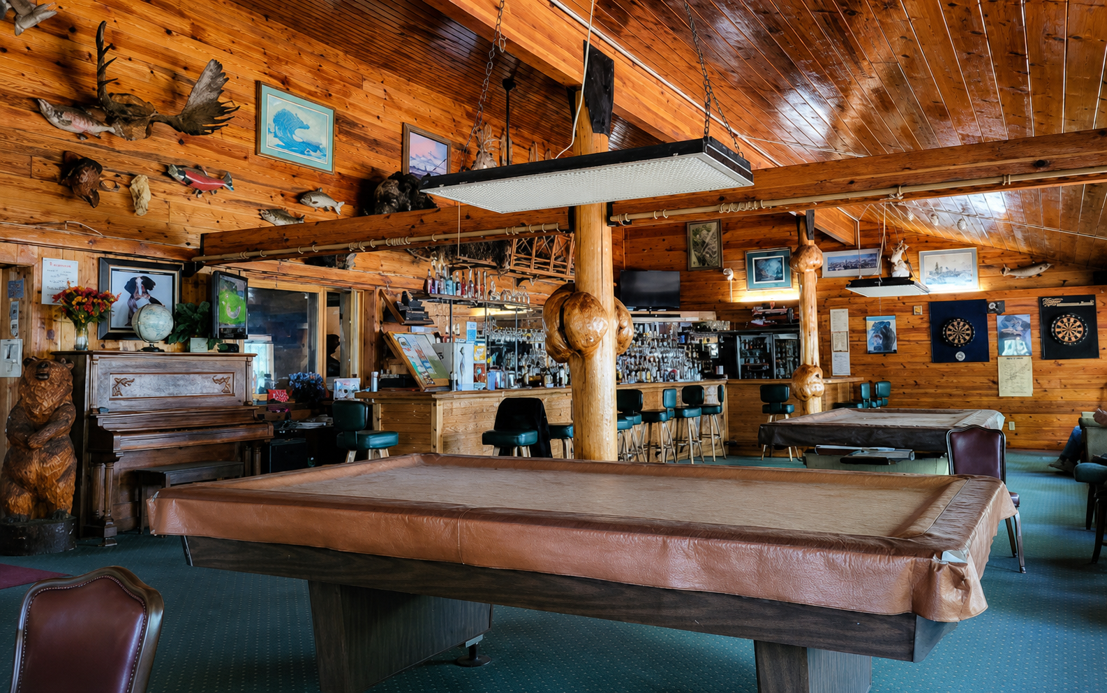 Enhanced high-resolution H&H Lakeview log interior with bar and pool table